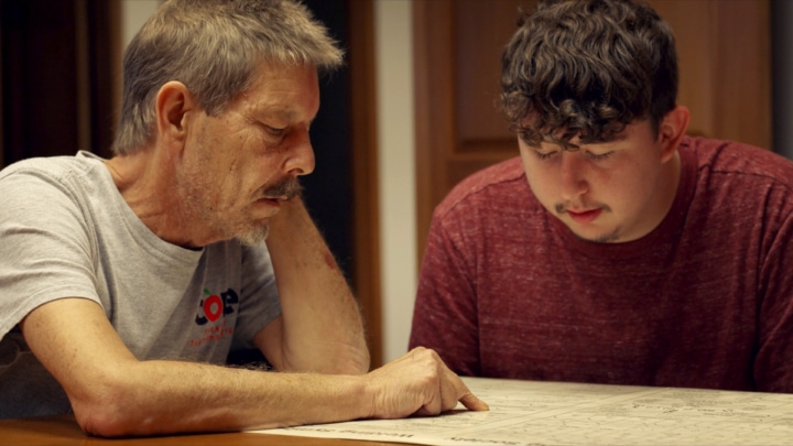 CORE Employement Specialist Explaining Engineering Drawings To A CORE Participant