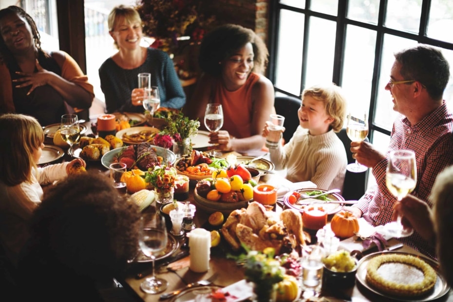 People Talking Around Table at Thanksgiving