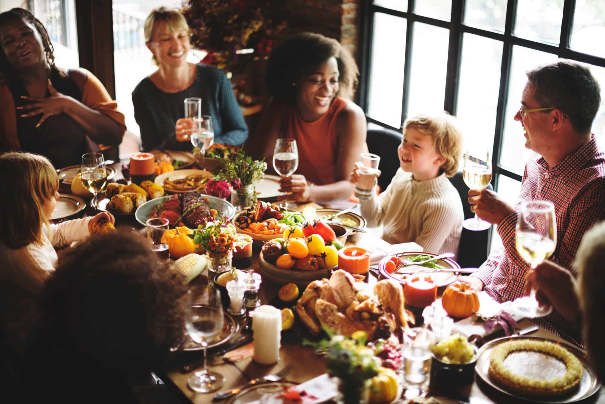 People Talking Around Table at Thanksgiving